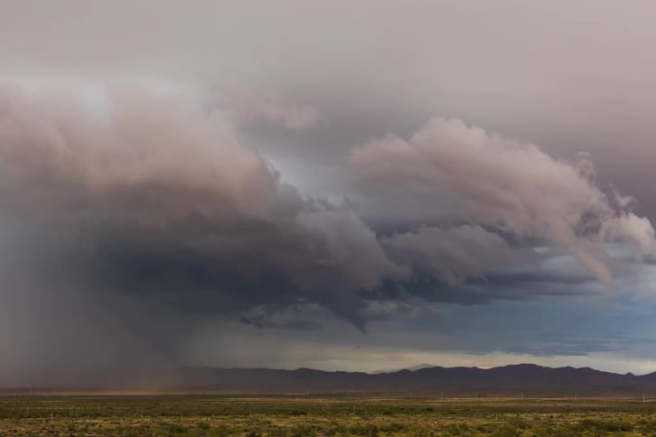 Storm clouds gather over plains