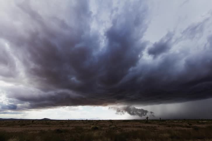 Storm clouds form and move down the horizon