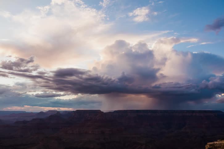 A storm passes over a canyon