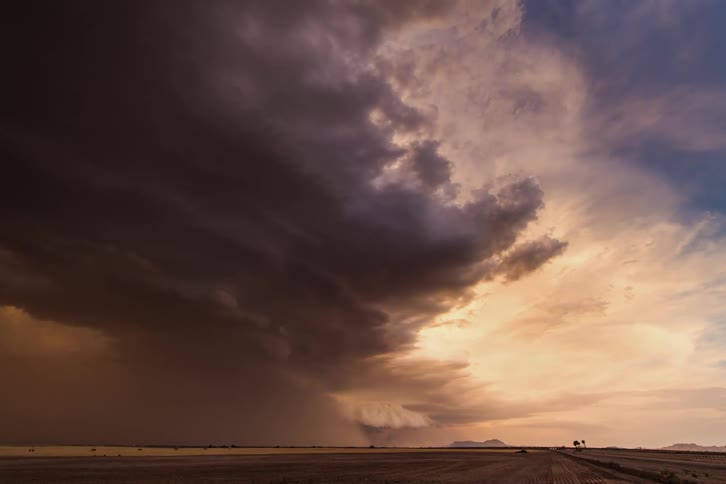 A storm builds at sunset