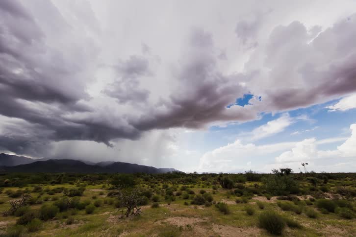Clouds roll over hilly plains