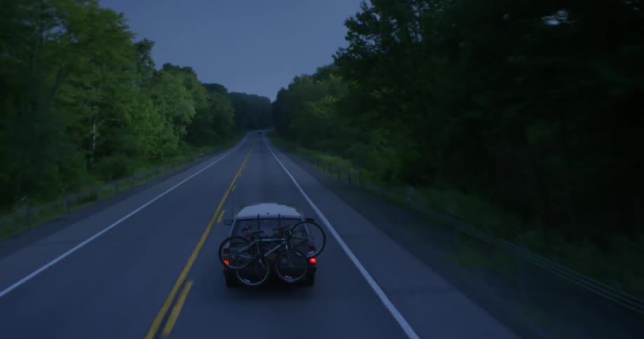 Car driving down a country road