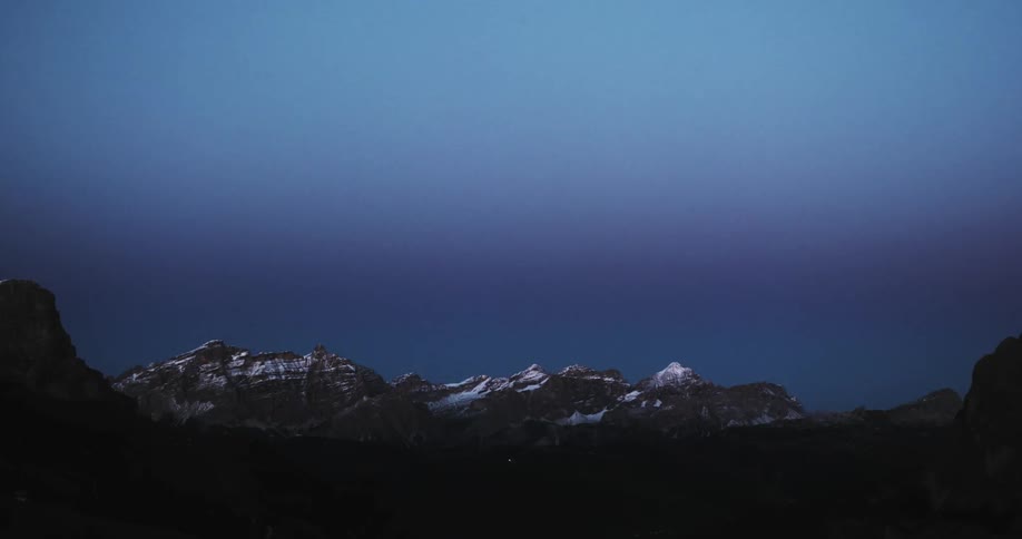 View of snowy mountains on an overcast evening