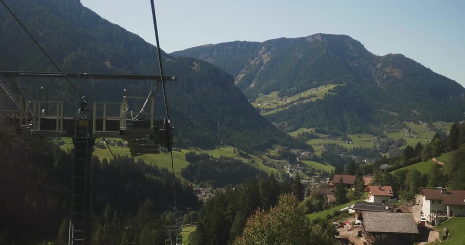 Wire lift goes down into a village in the mountains