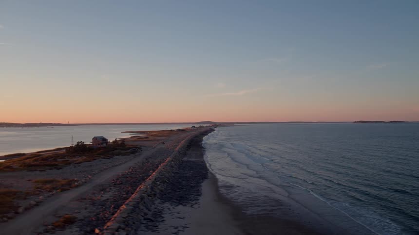 A strip of land across a body of water