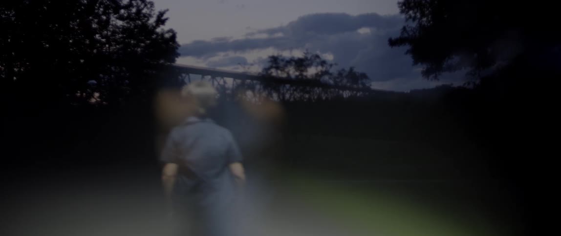 Child walking outside at sunset