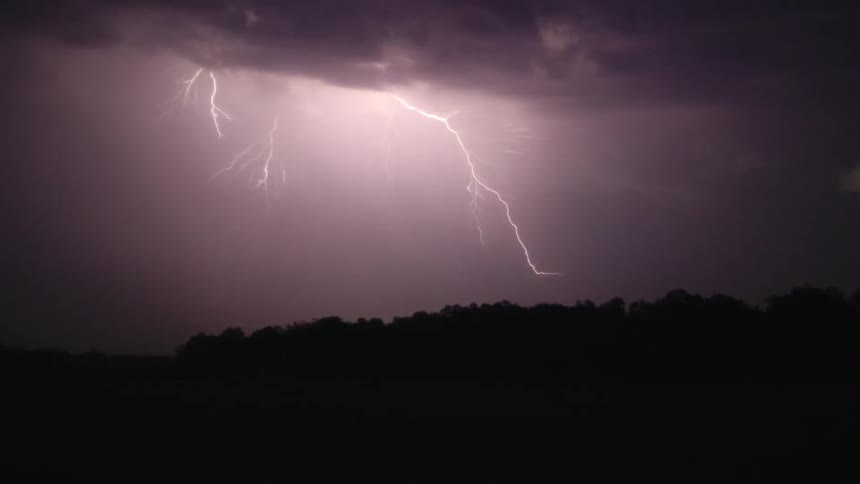 Lightning flashes in the night sky