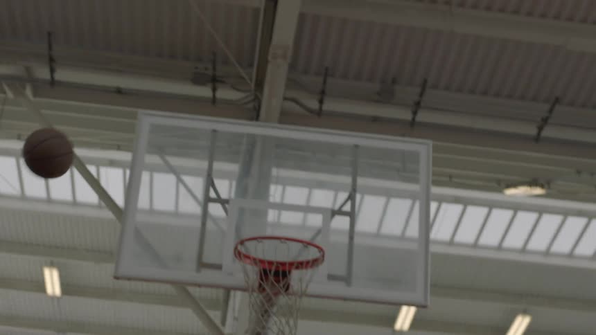 A man tries and fails to make a basket in basketball