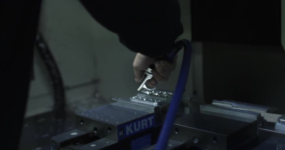 A man sprays an air compressor on top of a tools