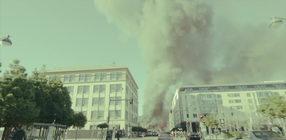 Smoke billows up from a building in a city
