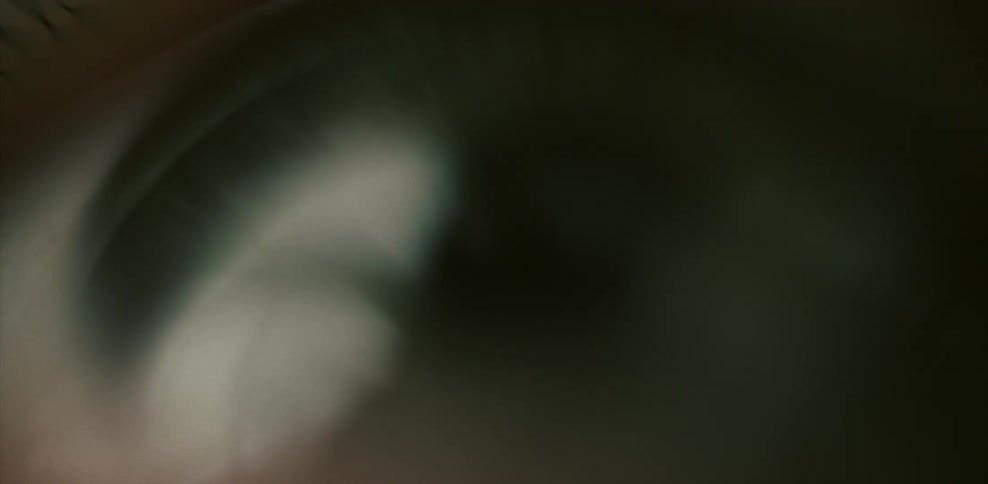 Light reflects on a blinking human eye
