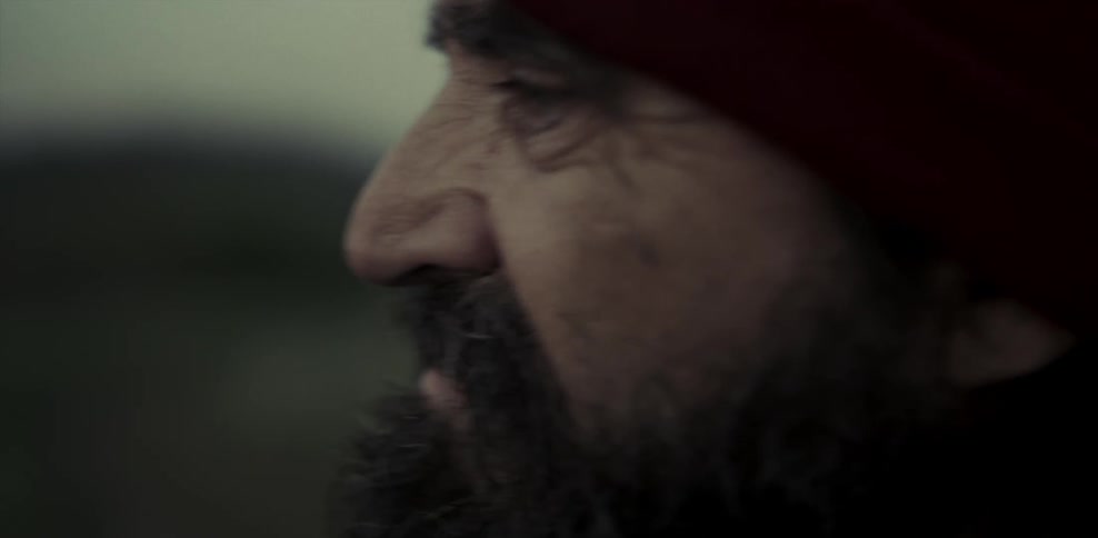 Elderly man's face looking sad