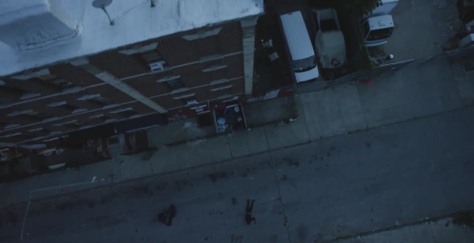Aerial view of victims laying on a city street
