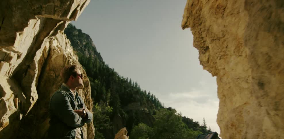 A man stands in a cavern