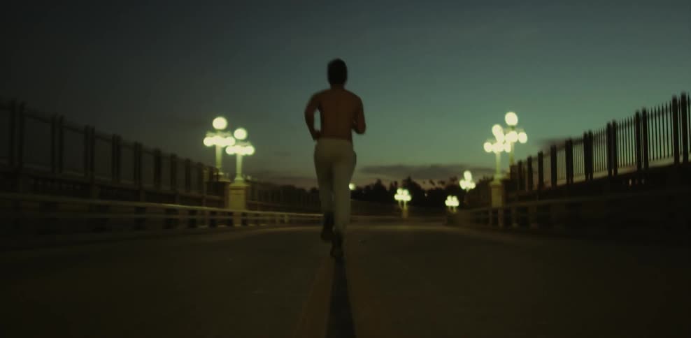 A man jogs down the highway