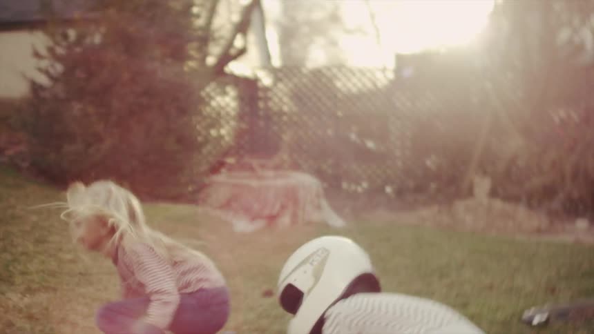 Two girls playing in their yard