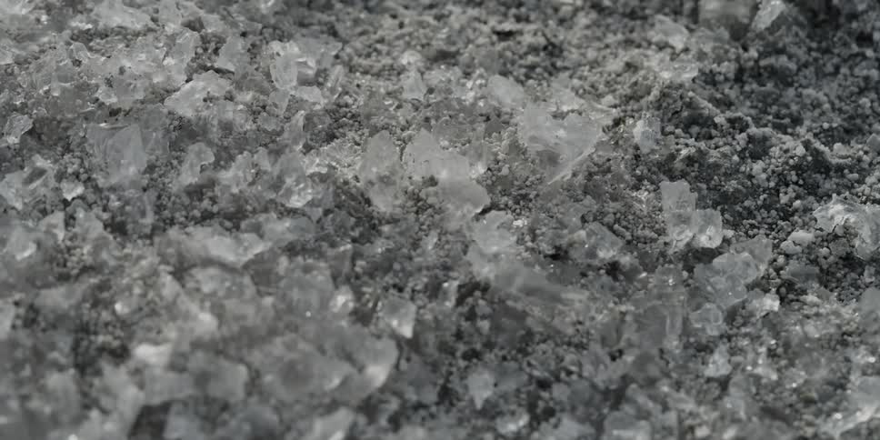 A close up view of some crystals or rocks laying on the ground