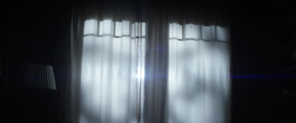 Sunlight shining through sheers on a window
