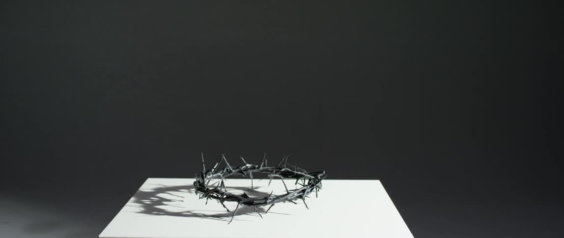 Crown of thorns sitting on a white table