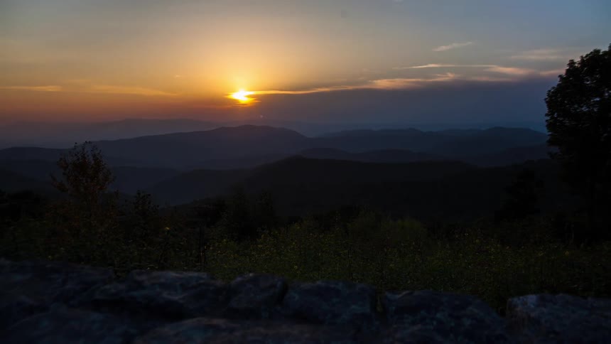 The sun setting over a mountain range