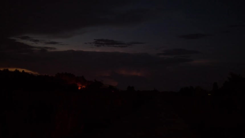 Lightning flashes from a distant storm