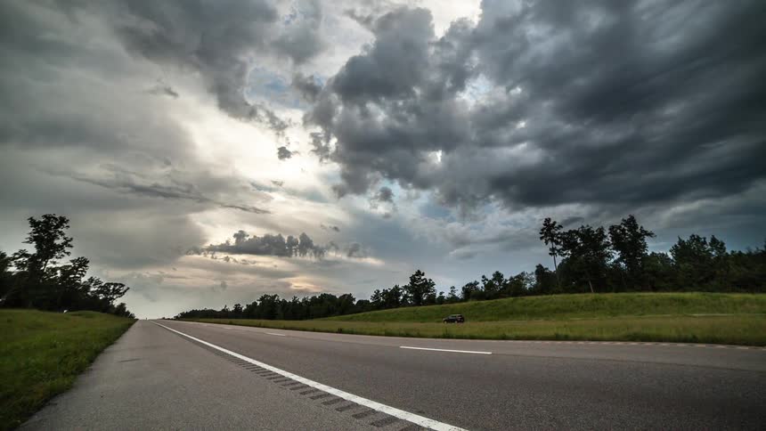 Time lapse of vehicles driving on a rural road