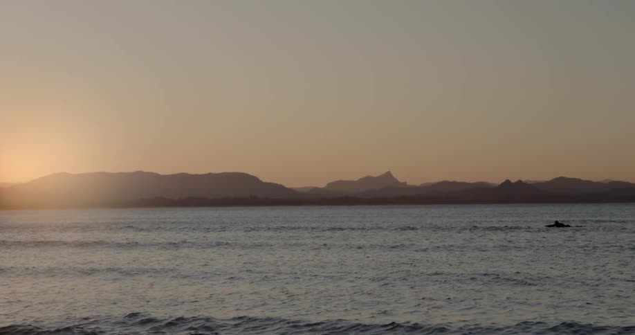 Sun shining over ocean waves