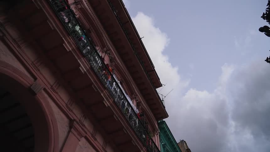 Clouds float over a building