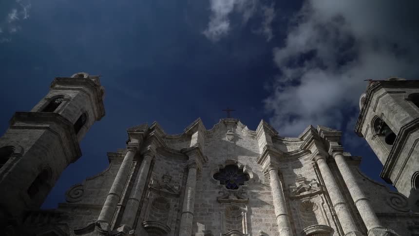 An old stone building towers into the sky
