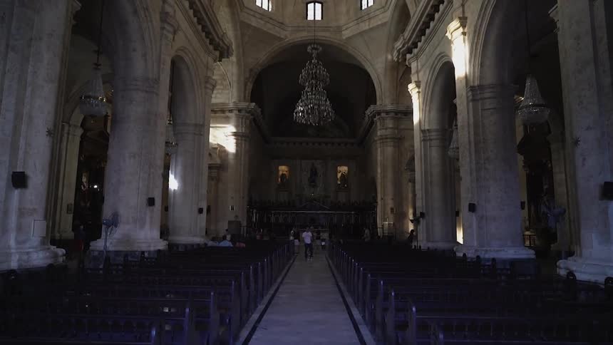People stand inside a chapel
