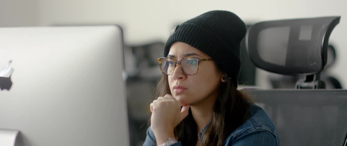 A woman is working on the computer