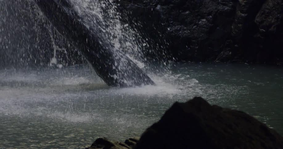 The water splashes down into the spring