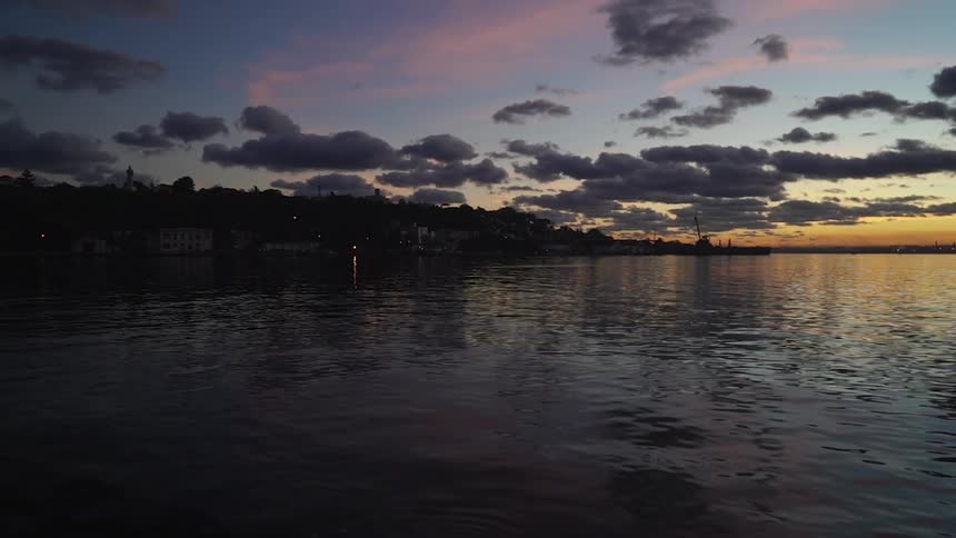 Water ripples on a lake at sunset