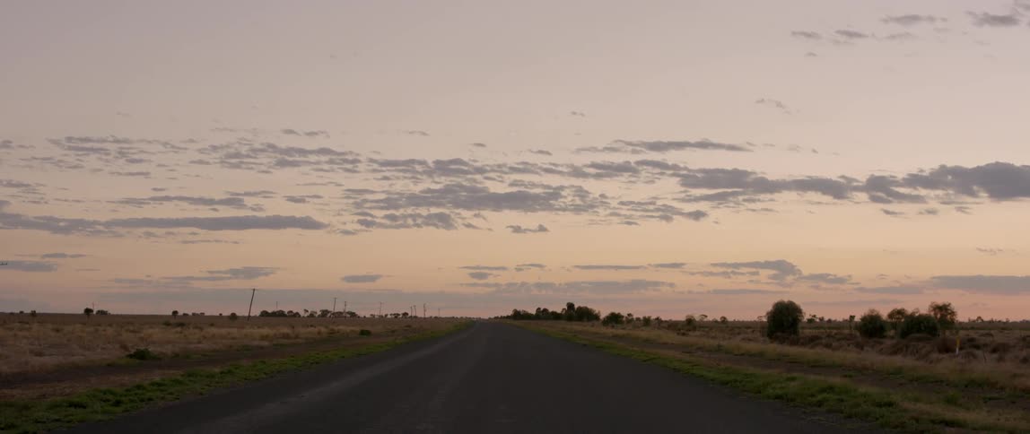 The road is empty at sunset