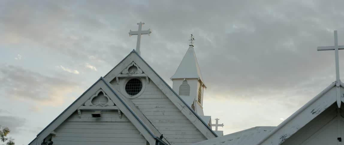 The church has heavy clouds above