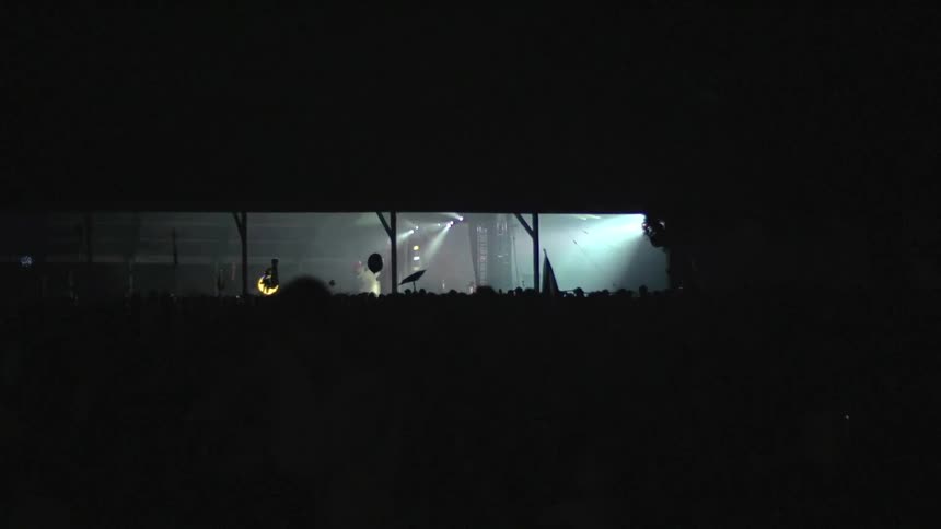 A crowd is watching a musical performance