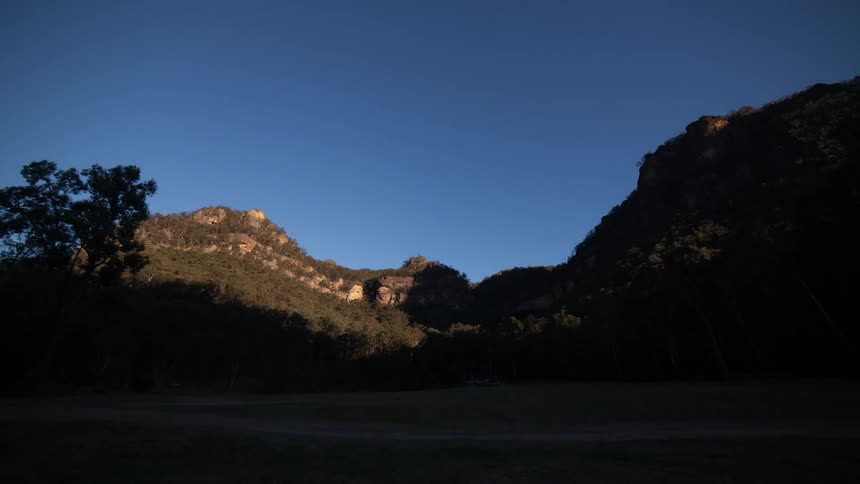 A timelapse shot of the sunrise in a canyon