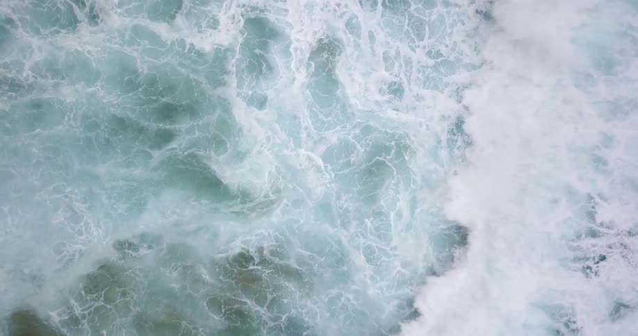 Ocean waves crash ashore