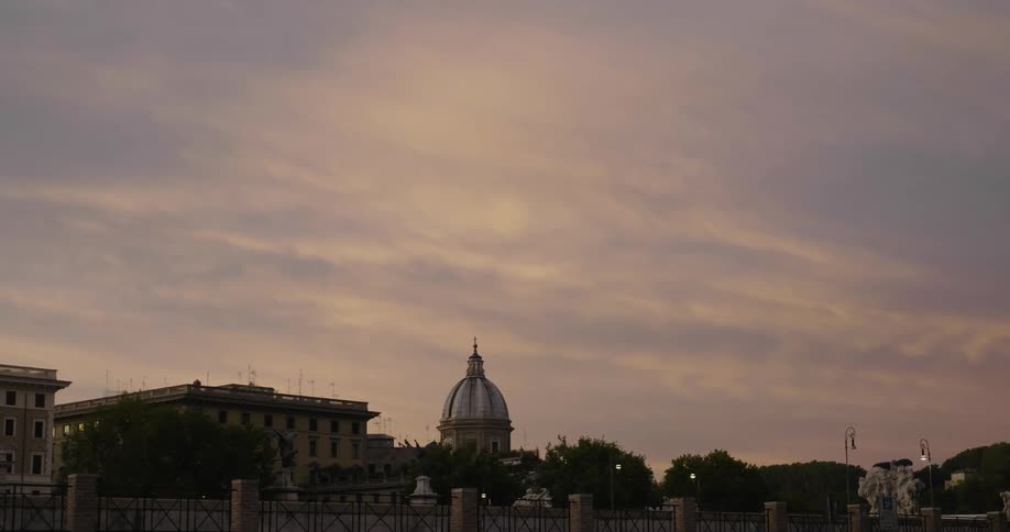 Buildings are shown at sunset