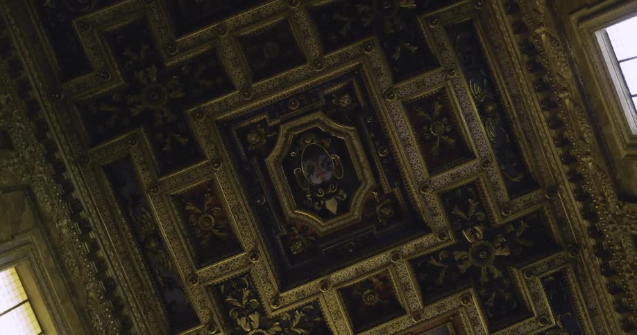 Ornate decorations cover a ceiling