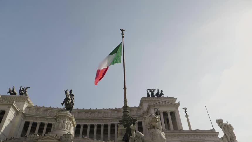 The flag is flying above the building