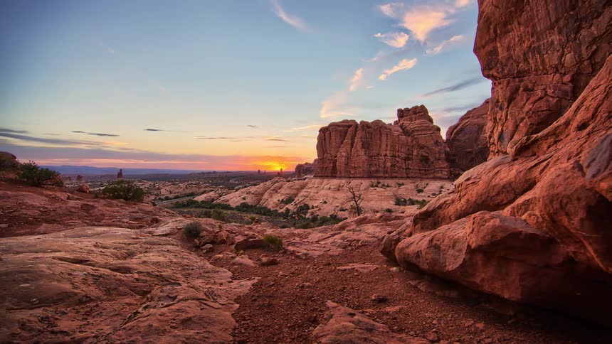 The sun is setting over the large canyon