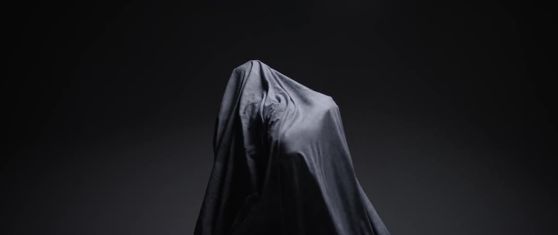 A person covered in a sheet