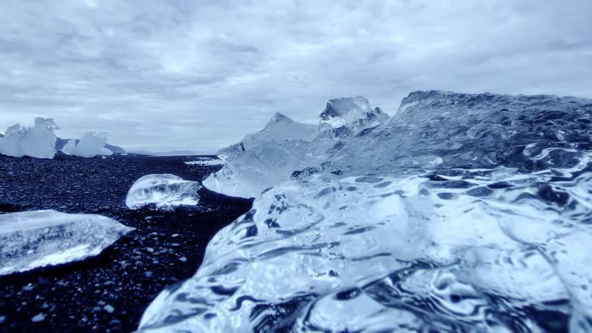 Clouds float over large ice chunks in the wilderness