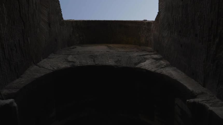 A stone arch stands overhead