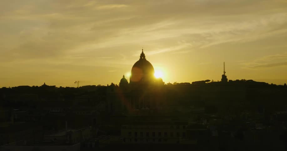 A large building ahead has a dome at the top