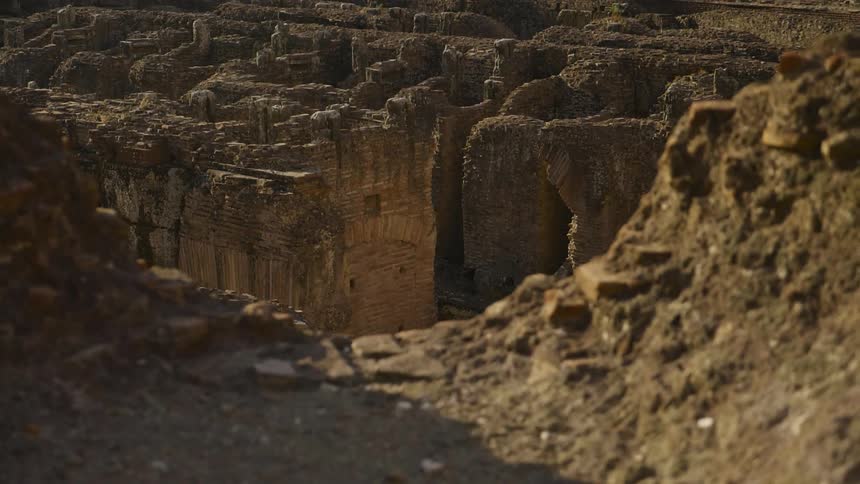The ruins of an ancient building stand in sunlight
