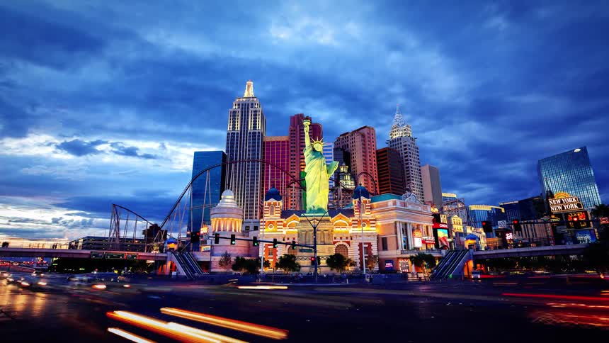 Traffic and pedestrians move in las vegas under stormy night skies