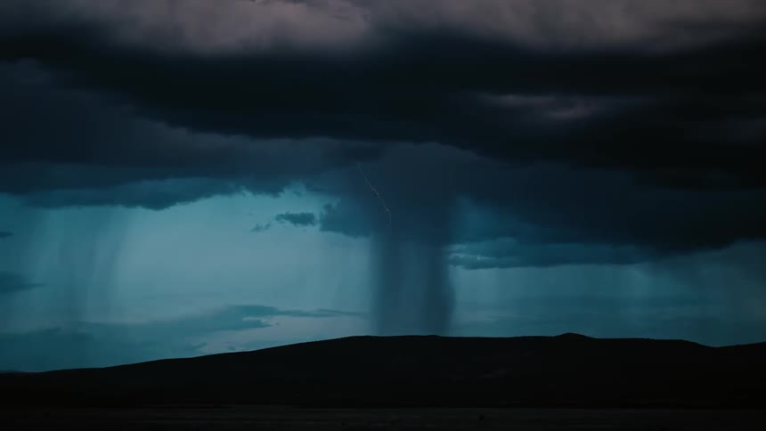 A large storm ahead is pouring rain and lightning all over