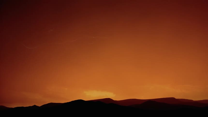 The dawn sky is lighting up with lightning